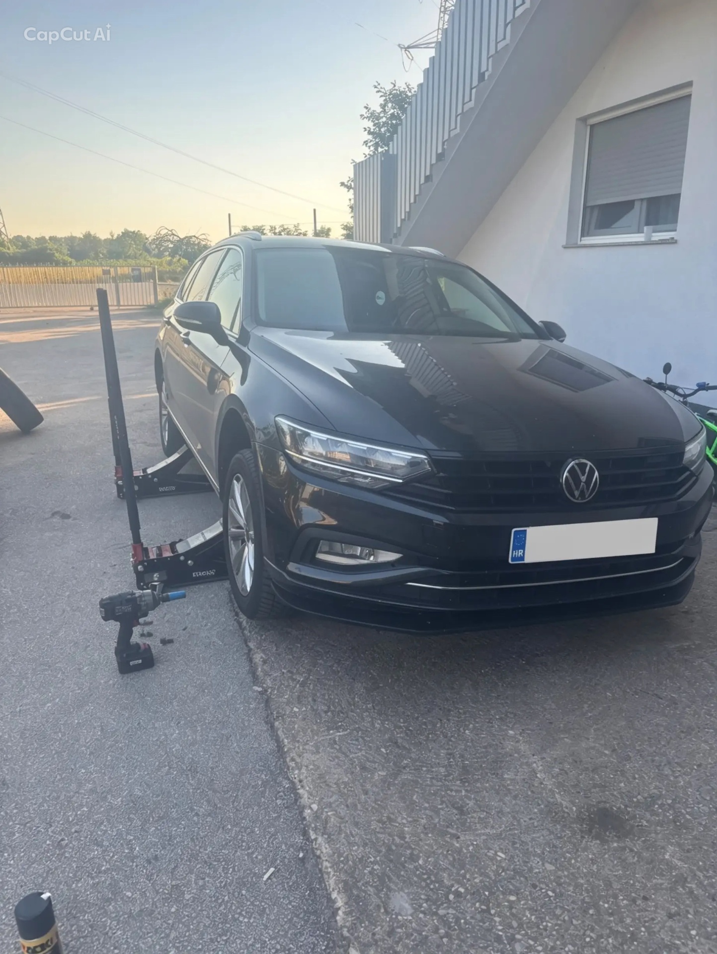 Black Volkswagen Passat during tire service